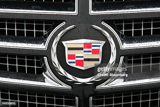 The General Motor's Cadillac emblem is displayed on an Escalade at a dealership in Raleigh, North Carolina, U.S., on Wednesday, April 1, 2009....