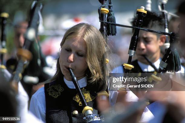 Lorient Inter Celtic festival, parade of bagpipe players, Brittany, France.