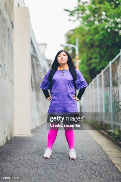 plus size japanese woman standing in confidence - plus size fashion stock pictures, royalty-free photos & images
