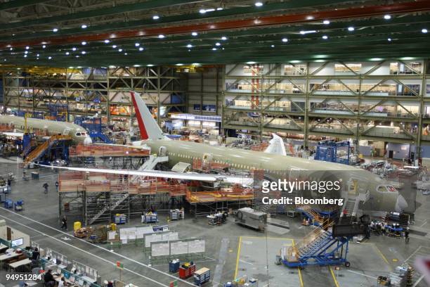 Employees work on the assembly line of the Boeing Co. 787 Dreamliner airplane at the company's manufacturing plant in Everett, Washington, U.S., on...