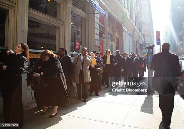 Job seekers line up outside of the Metropolitan Pavilion for a Careerbuilder.com career fair in New York, U.S., on Thursday, April 2, 2009. The...