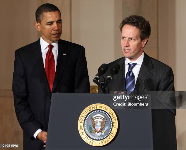 President Barack Obama, left, listens to Timothy Geithner, treasury secretary, speak about tax reform at the White House in Washington, D.C., U.S.,...