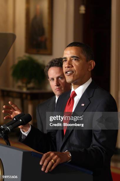 Timothy Geithner, U.S. Treasury secretary, left, listens as President Barack Obama makes an announcement on tax reform at the White House in...