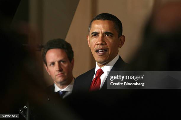 Timothy Geithner, U.S. Treasury secretary, left, listens as President Barack Obama makes an announcement on tax reform at the White House in...