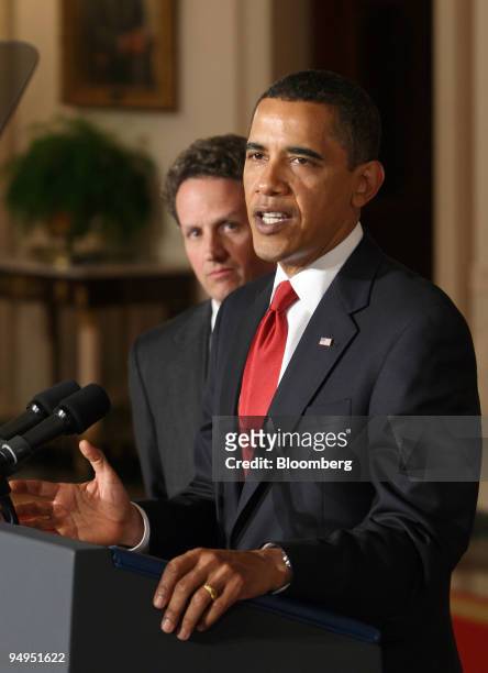Timothy Geithner, U.S. Treasury secretary, left, listens as President Barack Obama makes an announcement on tax reform at White House in Washington,...