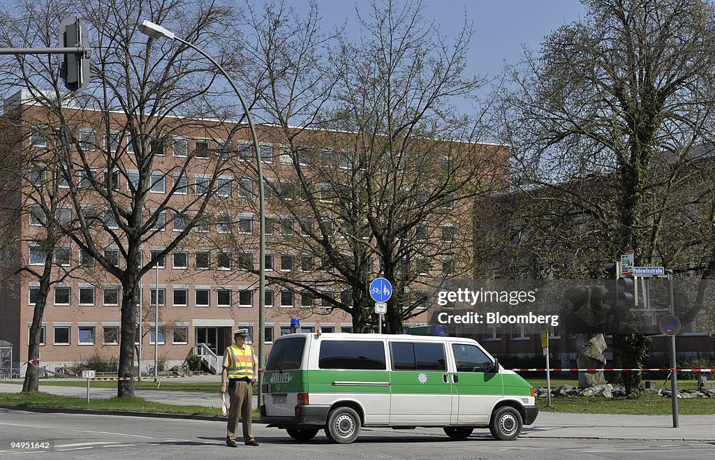 A policeman stands in front of the regional court, site of a