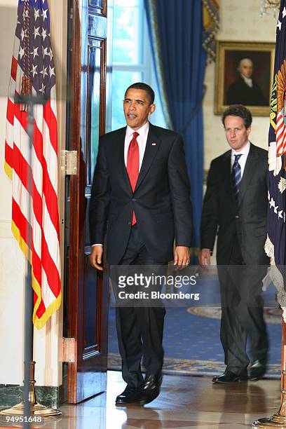 President Barack Obama, left, and Timothy Geithner, treasury secretary, arrive in the Grand Foyer of the White House to make an announcement on tax...