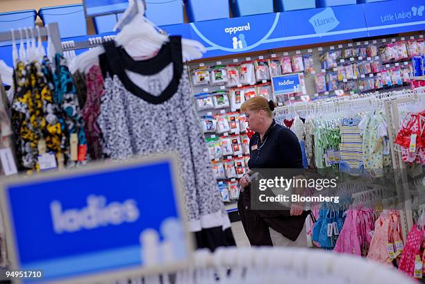 Employee Kathleen Poppel rearranges children's clothes at a Family Dollar store in Norcross, Georgia, U.S., on Tuesday, April 7, 2009. Family Dollar...