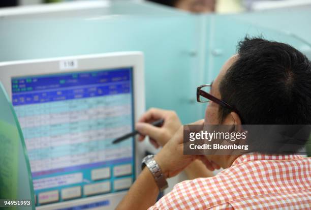 Man searches job listings on a computer at Ikebukuro Hello Work, a job center in the Toshima Ward, in Tokyo, Japan, on Friday, Aug. 28, 2009. Japan's...