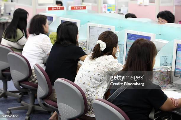 People search job listings on computers at Ikebukuro Hello Work, a job center in the Toshima Ward, in Tokyo, Japan, on Friday, Aug. 28, 2009. Japan's...