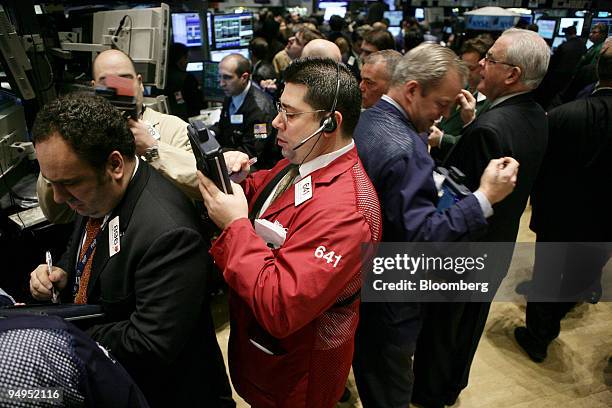 Trader Michael Capolino, center, works on the floor of the New York Stock Exchange in New York, U.S., on Wednesday, March 11, 2009. U.S. Stocks...