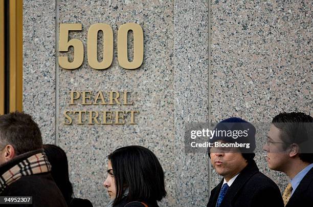 People line up outside to enter federal court in New York, U.S., on Thursday, March 12, 2009. Bernard Madoff, founder of Bernard L. Madoff Investment...