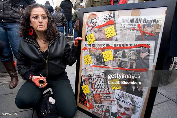 Artist Karen Dweck displays a collage of newspaper clippings on Bernard Madoff, founder of Bernard L. Madoff Investment Securities LLC, while Madoff...