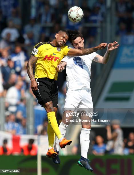 Daniel Keita-Ruel of Fortuna Koeln and Dennis Erdmann of 1. FC Magdeburg head for the ball during the 3. Liga match between 1. FC Magdeburg and SC...