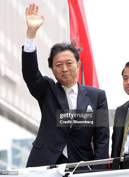 Yukio Hatoyama, president of the Democratic Party of Japan , waves during a campaign rally for the Aug. 30 lower-house election in Matsuyama City,...