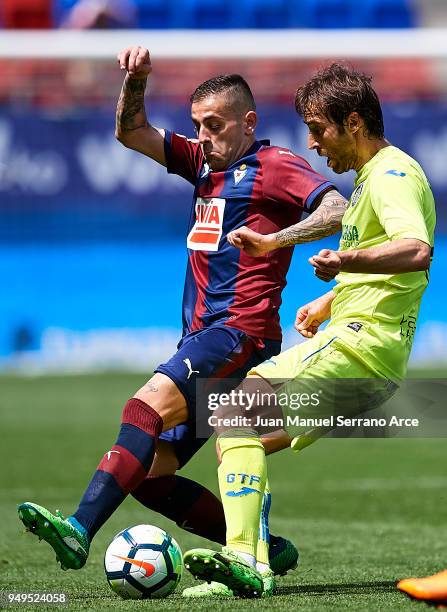 Mathieu Flamini of Getafe CF duels for the ball with Ruben Pena of SD Eibar during the La Liga match between SD Eibar and Getafe CF at Ipurua...