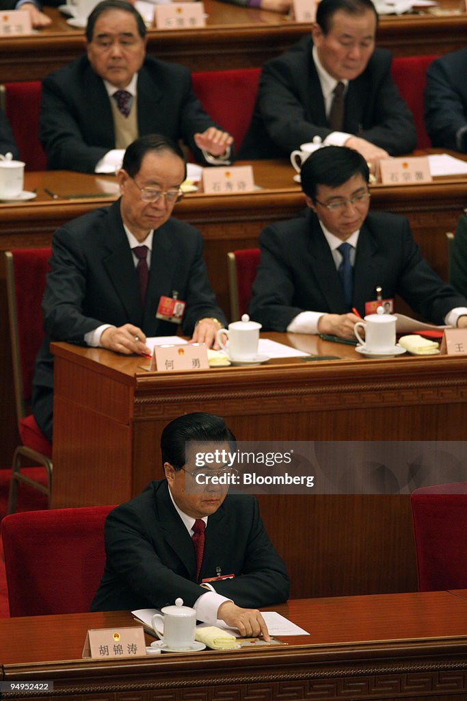 Hu Jintao, China's president, bottom, pushes a button signif