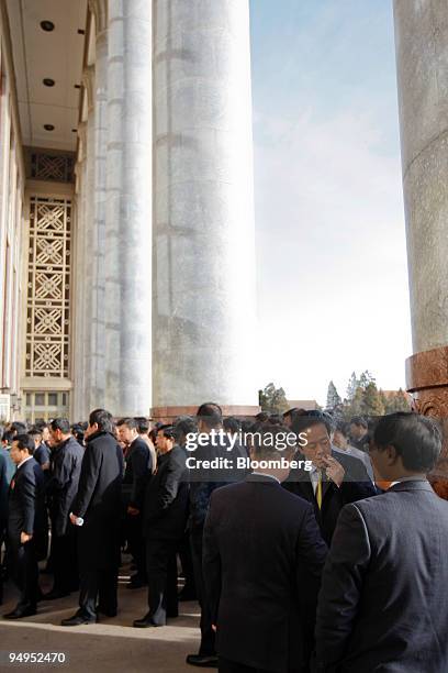 Delegates enter the Great Hall of the People for the closing ceremony of China's National People's Congress in Beijing, China, on Friday, March 13,...