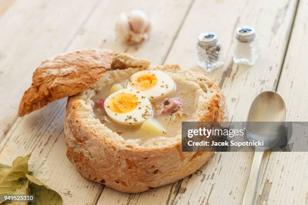 polish easter delicacy called zurek, traditional soup with eggs and sausage - easter poland stock pictures, royalty-free photos & images