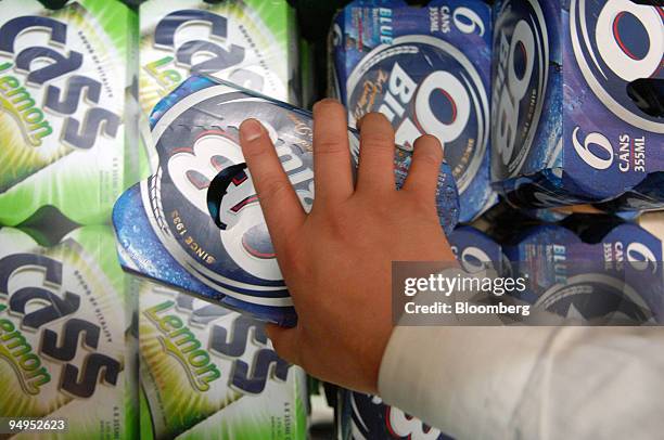 Oriental Brewery Co. Products are stacked at an E-Mart store in Ilsan, South Korea, on Wednesday, May 6, 2009. Anheuser-Busch InBev NV, the world's...