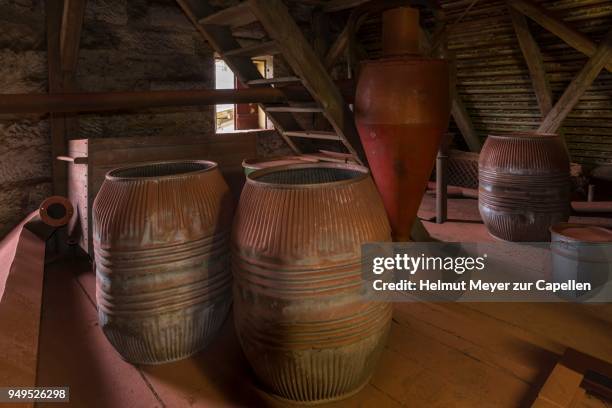 production room with old barrels covered with bronze dust, metal powder plant, founded around 1900, upper franconia, bavaria, germany - powder room stock pictures, royalty-free photos & images