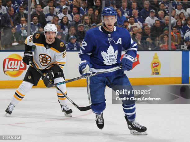 Tim Schaller of the Boston Bruins skates against Tyler Bozak of the Toronto Maple Leafs in Game Four of the Eastern Conference First Round in the...