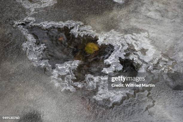 ice structur in frozen brook, drusel, hesse, germany - structuur stock pictures, royalty-free photos & images