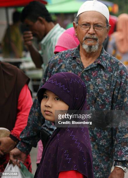 Muslims shop at a market near Kota Bharu in Kelantan, Malaysia, on Wednesday, Sept. 9, 2009. Growing Islamic conservatism in Malaysia's Kelantan...