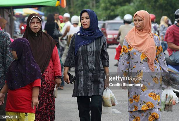 Muslim women shop at a market near Kota Bharu in Kelantan, Malaysia, on Wednesday, Sept. 9, 2009. Growing Islamic conservatism in Malaysia's Kelantan...