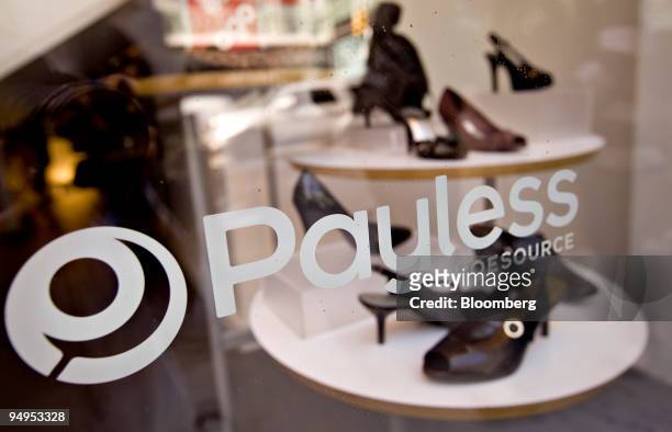 Shoes sit on display in the window of a Payless ShoeSource store in New York, U.S., on Wednesday, Sept. 2, 2009. Collective Brands Inc., owner of...