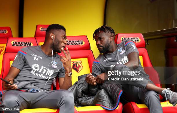 Timothy Fosu-Mensah of Crystal Palace talks to Pape Souare of Crystal Palace prior to the Premier League match between Watford and Crystal Palace at...