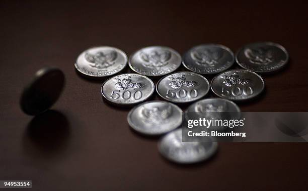 Indonesian rupiah coins are arranged for a photograph in Jakarta, Indonesia, on Thursday, Sept. 3, 2009. Indonesia's rupiah rose, snapping a...