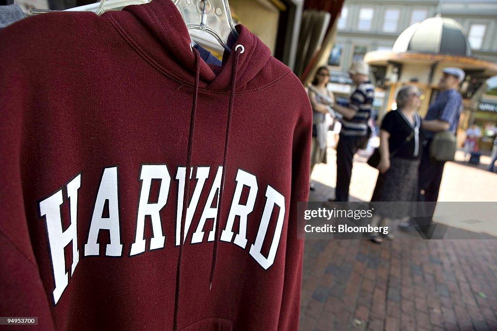 A Harvard University logo appears on a sweatshirt on display