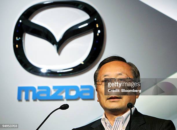 Takashi Yamanouchi, president of Mazda Motor Corp., speaks during the unveiling of the Axela compact vehicle in Tokyo, Japan, on Thursday, June 11,...