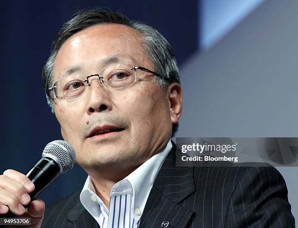 Takashi Yamanouchi, president of Mazda Motor Corp., speaks during the unveiling of the Axela compact vehicle in Tokyo, Japan, on Thursday, June 11,...