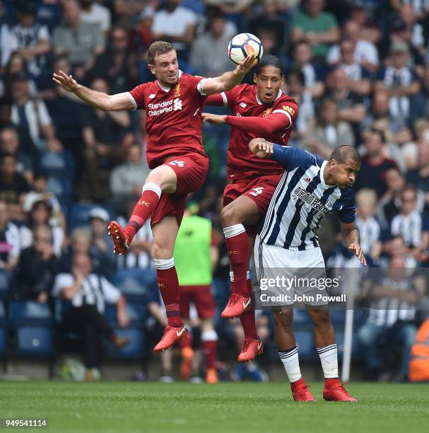 Jordan Henderson and Virgil van Dijk of Liverpool with Salomon Rondon of West Bromwich during the Premier League match between West Bromwich Albion...