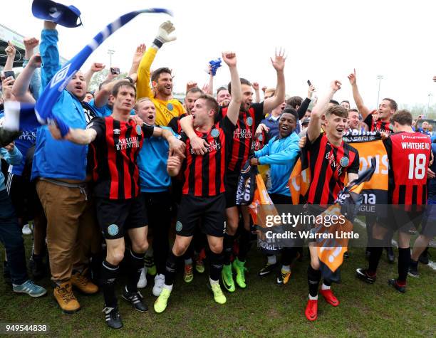 Macclesfield Town players celebrate after gaining promotion during the Vanarama National League match between Eastleigh and Macclesfield Town at...