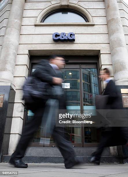 Pedestrians walk past a branch of Cheltenham and Gloucester building society in London, U.K., on Tuesday, June 9, 2009. Lloyds Banking Group Plc ,...