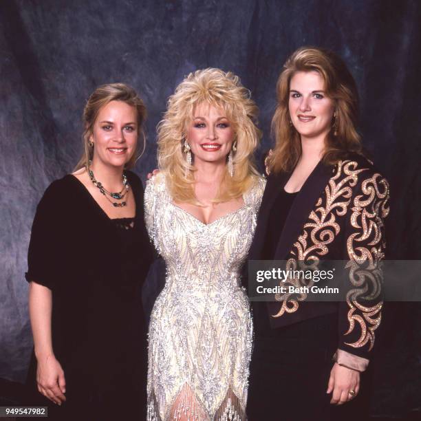 Country singer and songwriter Dolly Parton,poses with Mary Chapin Carpenter, and Tricia Yearwood backstage the CMA Award Show Backstage October 10,...