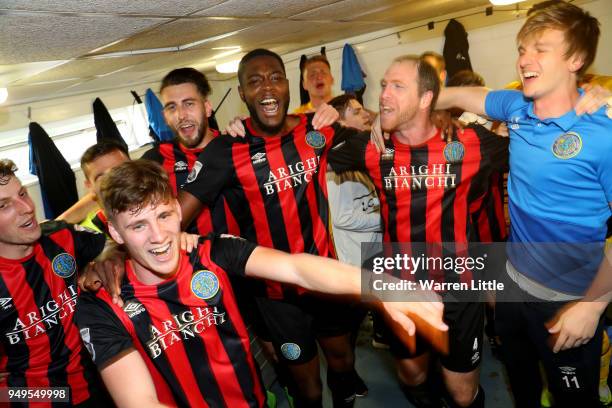 Macclesfield Town players celebrate in the changing room after gaining promotion during the Vanarama National League match between Eastleigh and...