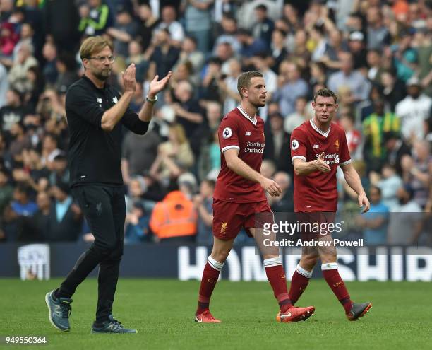 James Milner and Jordan Henderson of Liverpool with Jurgen Klopp at the end of the Premier League match between West Bromwich Albion and Liverpool at...