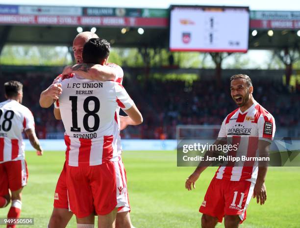 Toni Leistner, Kenny Prince Redondo and Akaki Gogia of 1 FC Union Berlin celebrate after scoring the 1:1 during the match between Union Berlin and 1....