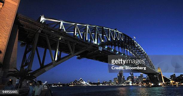 The Sydney Harbour Bridge, the Sydney Opera House and the city of Sydney are seen prior to Earth Hour in Sydney, Australia, on Saturday, March 28,...