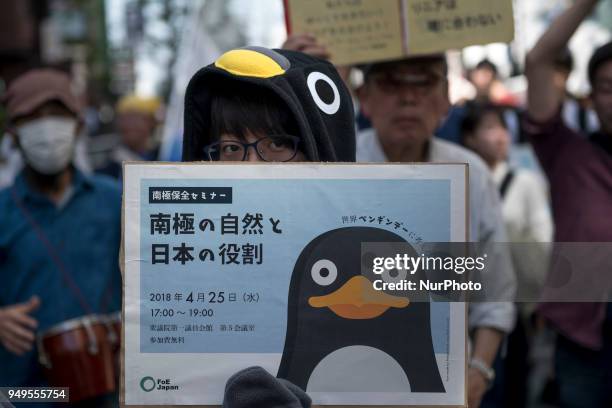 Activist holds placard during the Annual Earth Day in Shibuya district, Tokyo on 21 April 2018. Environmental activists commemorated Earth Day with a...