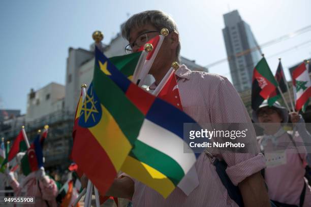 Activist holds flags during the Annual Earth Day in Shibuya district, Tokyo on 21 April 2018. Environmental activists commemorated Earth Day with a...