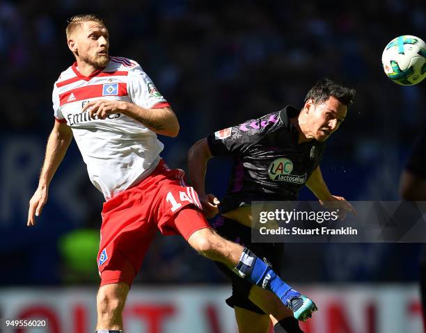 Aaron Hunt of Hamburg fights for the ball with Nicolas Hoefler of Freiburg during the Bundesliga match between Hamburger SV and Sport-Club Freiburg...