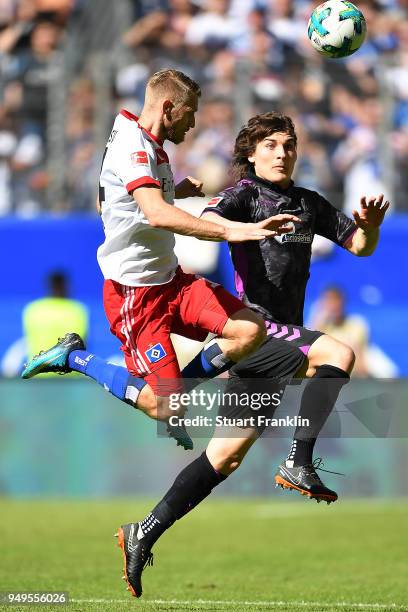 Aaron Hunt of Hamburg fits for the ball with Caglar Soeyuencue of Freiburg during the Bundesliga match between Hamburger SV and Sport-Club Freiburg...