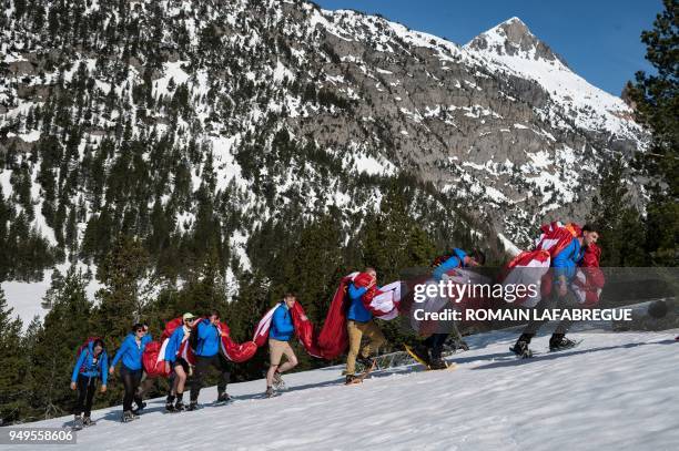 Activists from the French far-right political movement Generation Identitaire and European anti-migrant group Defend Europe carry supplies during an...