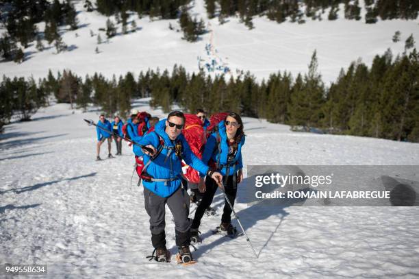 Activists from the French far-right political movement Generation Identitaire and European anti-migrant group Defend Europe carry supplies during an...