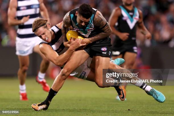Chad Wingard of the Power is tackled by Jake Kolodjashnij of the Cats during the 2018 AFL round five match between the Port Adelaide Power and the...